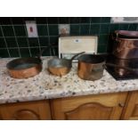 Three 19th. C. copper and metal saucepans { 7cm H X 25cm W }.