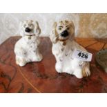 Pair of Royal Doulton Stafforshire models of dogs {15 cm H x 10 cm W}.