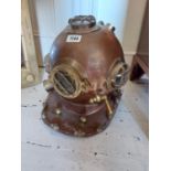 Copper and brass divers helmet {40 cm H x 37 cm W x 45 cm D}.