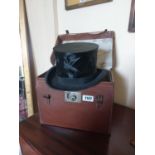 Early 20th C. top hat in original leather case {27 cm H x 34 cm W x 23 cm D}.