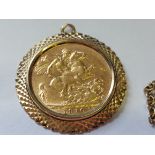 1910 Gold sovereign mounted in a yellow metal mount with chain