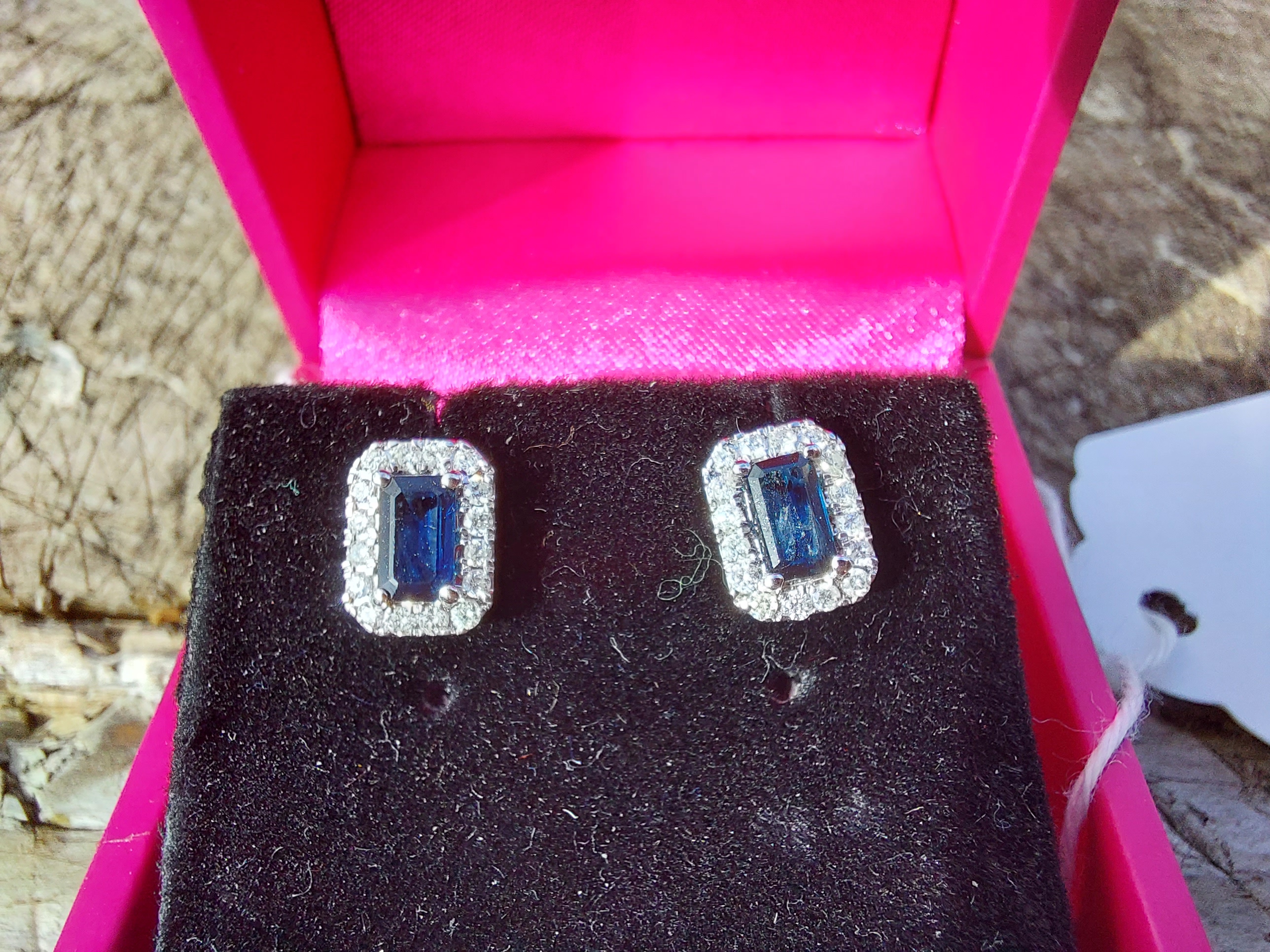 Pair of 18ct. White gold sapphire and diamond earrings. Estimated: weight of diamonds 82points / .