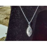18ct. white gold diamond pendant necklace on gold chain.