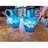 Pair of 19th C. blue glass jugs decorated with hand painted flowers {20 cm H x 16 cm Dia.}.
