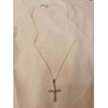 9ct. white gold diamond set crucifix necklace.