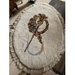 Good quality Donegal centre carpet decorated with Celtic brooch {170 cm L x 128 cm W}.