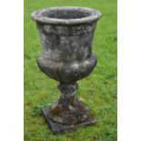 Large sandstone urn on square base {118 cm H x 62 cm Dia.}.