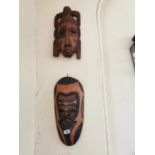 Two African wooden masks { 44cm H X 24cm W & 52cm H X 27cm W }.