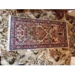 Hand made Persian Sarouk carpet {130 cm L x 67 cm W}.