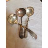 Pair of plain silver plated sauce ladles (initialled P) and another similar.