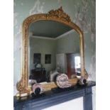 Gilt over mantle mirror in the 19th. C. style {135 cm H x 134 cm W}.