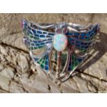 Silver and plaque a jour cuff bangle with opal cabochon in the Art Deco style