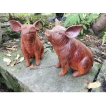 Pair of cast iron models of pigs