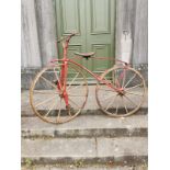 Rare 19th. C. bone shaker bicycle with wooden wheels and leather saddle. { 133cm H X 177cm W }