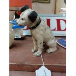 HMV dog in the form of a cast iron money box. {14 cm H x 17 cm W x 6 cm D}.