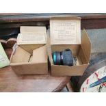 WWII gas mask in box and empty box.{10 cm h x 18 cm W x 14 cm D}