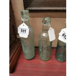 Two 19th C. glass bottles - Thomas Murphy and Co Clonmel and Corcoran and Co Carlow. {23 cm H x 6 cm