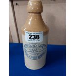 Richard Grey Wine and Spirit Merchant Carrick on Suir stoneware Ginger beer bottle. {20 cm H x 7