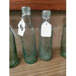 Two 19th C. glass bottles - P O'Donovan Limerick {23 cm H x 6 cm Dia}