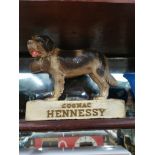 Early 20th. C. Hennessy Cognac ruberoid dog advertising figure. {24 cm H x 27 cm W x 11 cm D}.