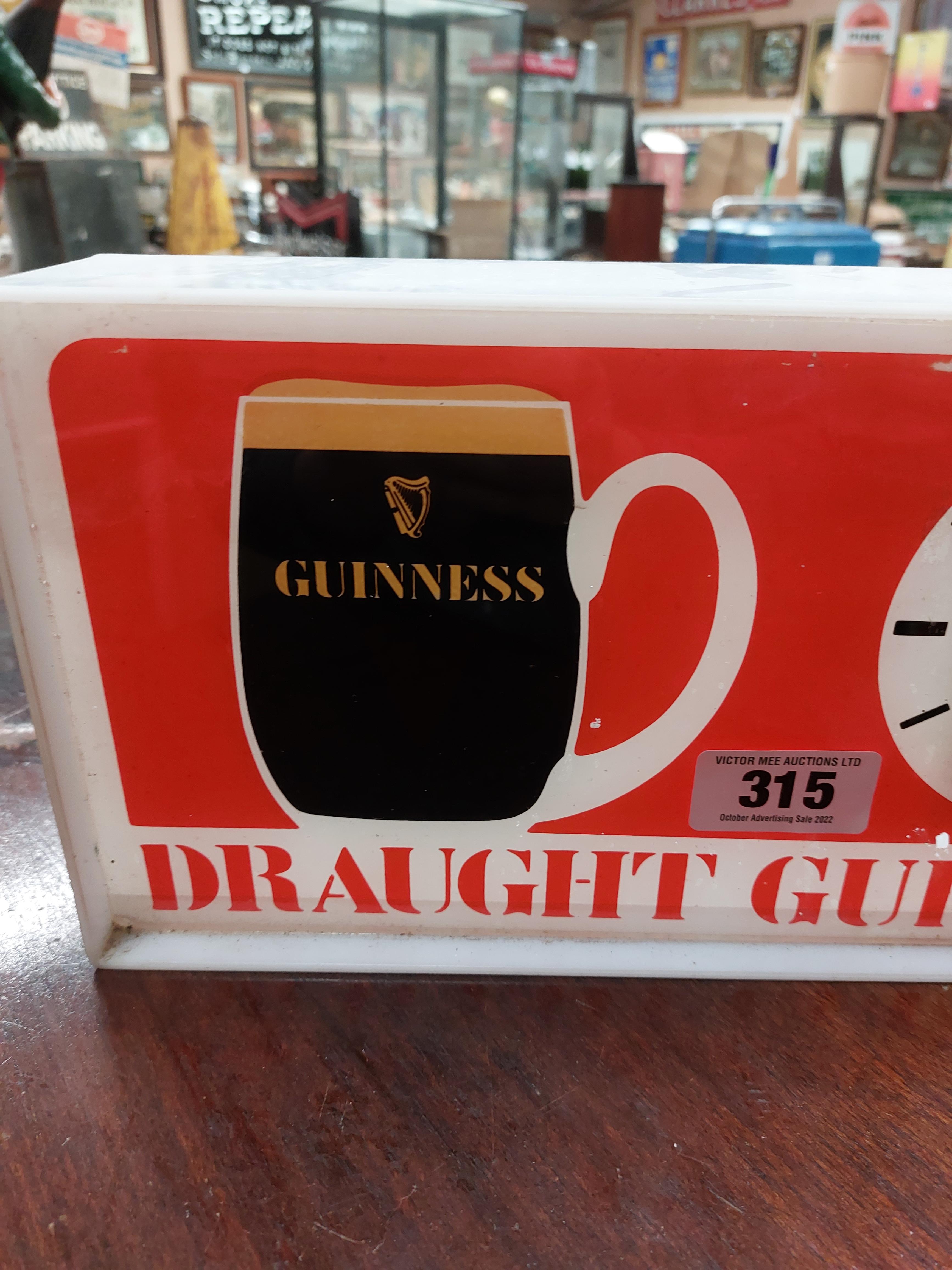 Perspex Draught Guinness light up advertising clock { 18 cm H x 36 cm W x 7 cm D}. - Image 2 of 3