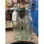 Two 19th C. glass bottles - Downes and Sons Ennis. {23 cm H x 6 cm Dia}