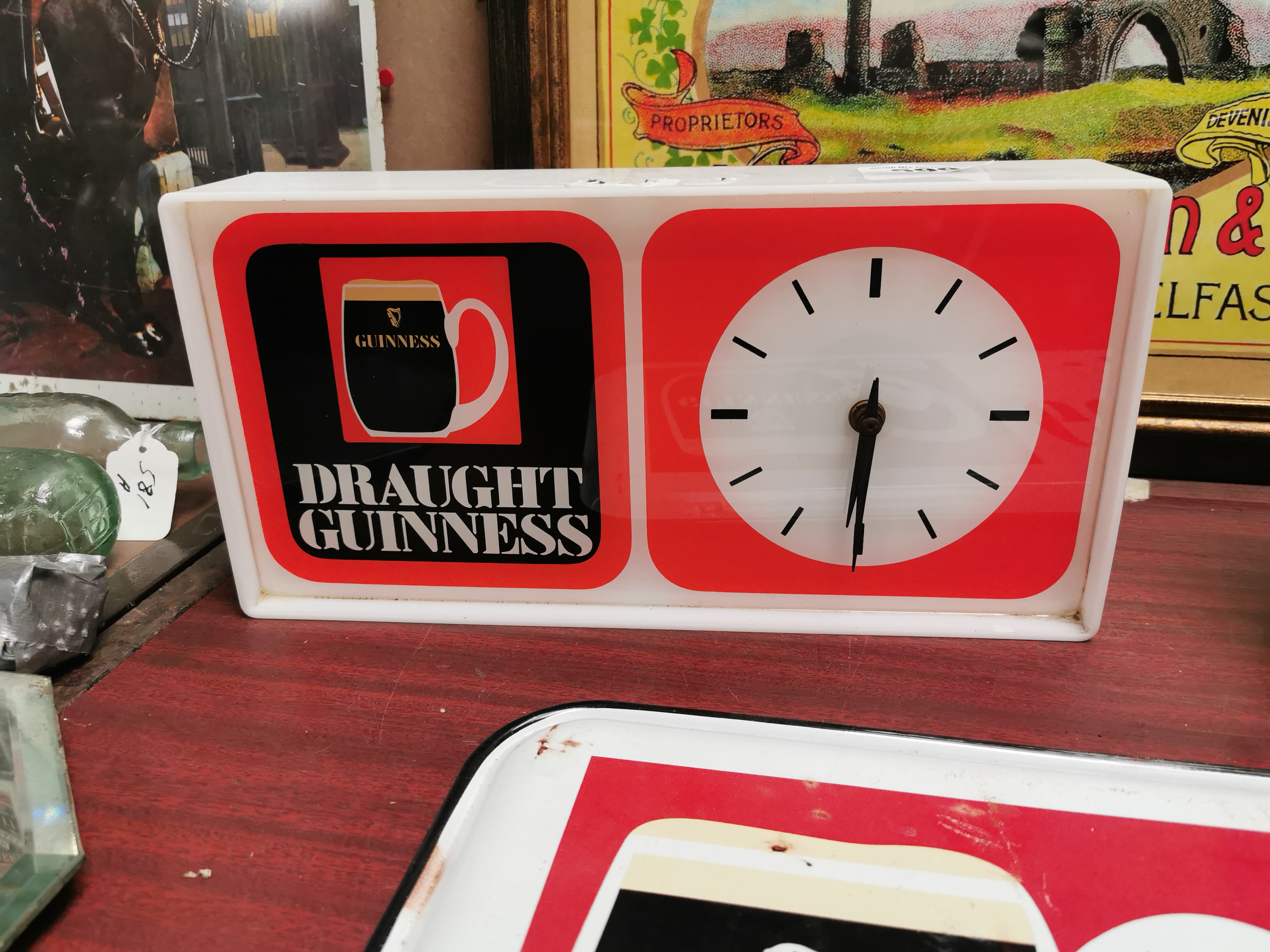 Draught Guinness perspex advertising clock { x 36 cm W x 7 cm D}.