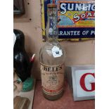 Large Bell's Whiskey advertising bottle. {53 cm H x 16 cm Dia}