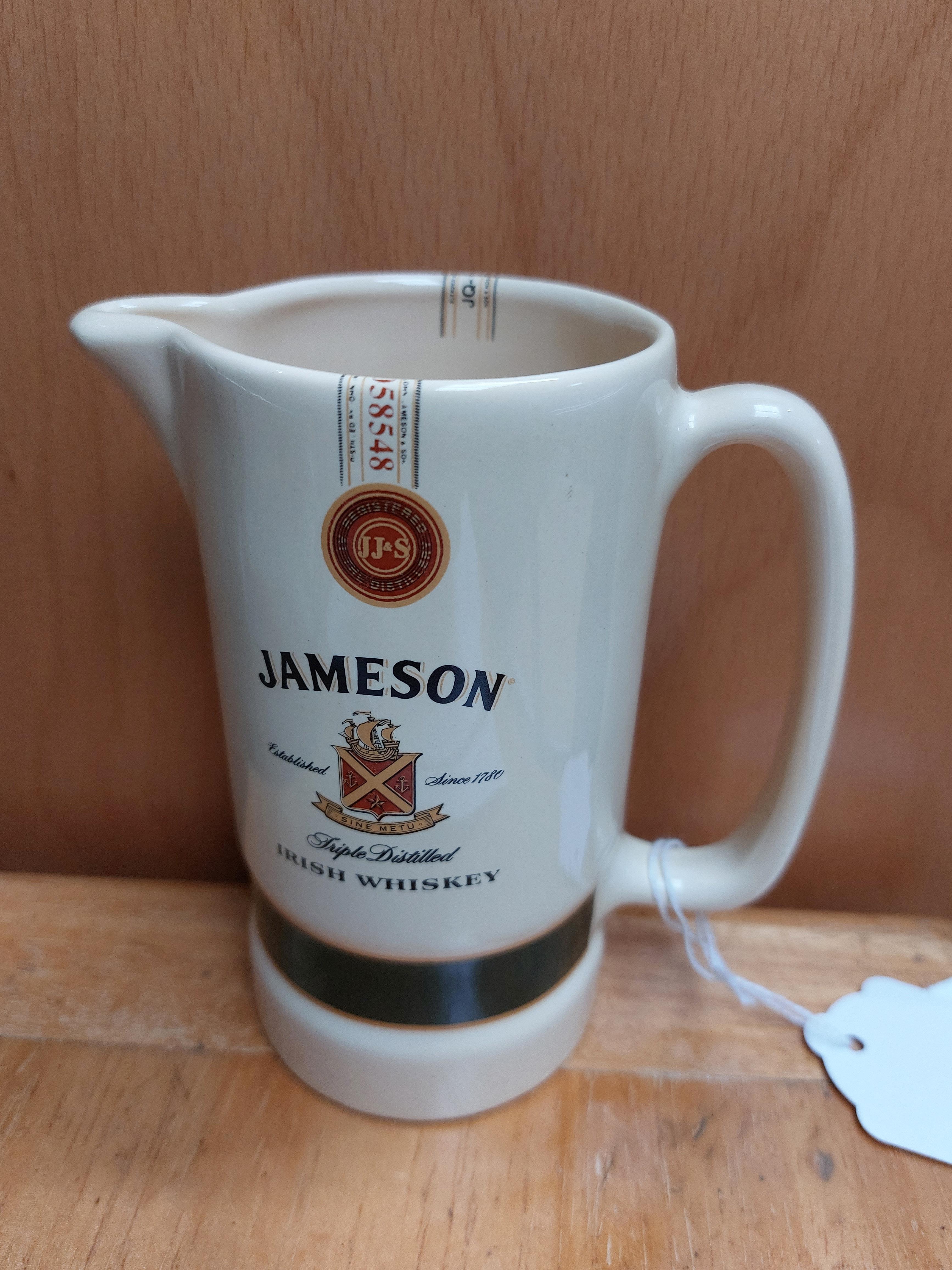 Jameson Irish Whiskey water jug. { 23 cm H x 11 cm W x 7 cm D}.