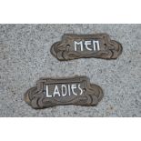 Pair of metal Ladies and Men plaques in the Art Nouveau style . { 8cm H X 18cm W }.