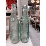 Two 19th C. glass bottles - C J Hassett Ennis and Hovenden and Orr Ltd Dublin. {22 cm H x 6 cm