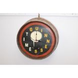 Guinness advertising clock in the form of abrass bound ¼ barrel top { 56cm Dia }
