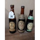 Three bottles of Guinness - John Martin label, Dublin Brewer. {23 cm H x 6 cm Dia}.