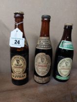 Three bottles of Guinness - John Martin label, Dublin Brewer. {23 cm H x 6 cm Dia}.