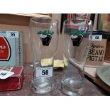 Two Guinness Christmas pint glasses. {18 cm H x 7 cm Dia}.