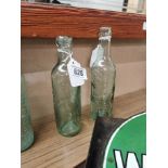 Two 19th C. glass bottles - E Smithwick and Sons Kilkenny and Cantrell and Cochrane. {23 cm H x 6 cm