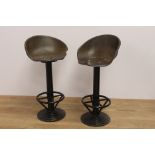 Pair of cast iron swivel tractor seat stools { 98cm H X 45cm W X 34cm D }.