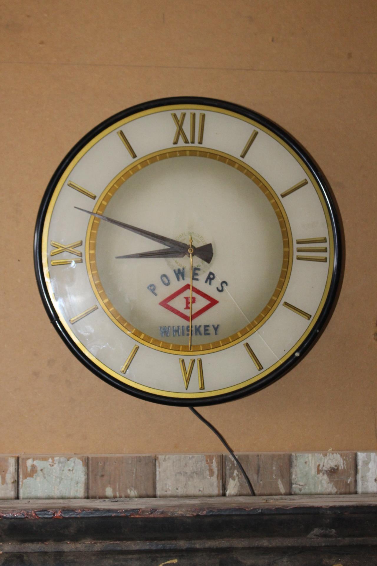Power's Whiskey advertising wall clock. { 42cm Dia }.