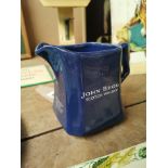 1960's ceramic John Begg Whiskey advertising water jug. {14 cm H }.