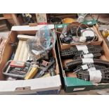 Two boxes of tin plate train set parts - tracks, engines and carriages etc.