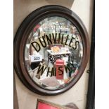 Dunville's Whiskey oval advertising mirror with original brass frame. {44 cm H x 38 cm W}.