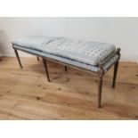 Bleached oak window seat with upholstered seat and cushion raised on tapered reeded legs { 55cm H