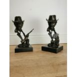 Pair of bronze Cowboys on marble bases {33 cm H x 15 cm W x 15 cm D}.