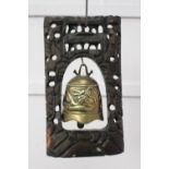 Tibetian brass bell in wooden frame { 35cm H X 20cm W X 10cm D }.