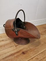 Good quality 19th C. copper coal scuttle with wrought iron handle {44 cm H x 35 cm W x 57 cm D}.
