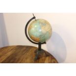 World globe on cast iron stand { 64cm H X 33cm Dia }.