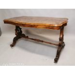 19th C. burr walnut sofa table raised on lyre supports and four outswept legs on turned stretcher {