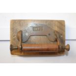 Metal and wood toilet roll holder stamped 1883 { 14cm H X 20cm W X 10cm D }.