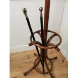 Two ebony walking sticks with silver plated finials { 91cm H }