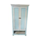 Painted pine robe with two panelled doors above drawer space raised on bun feet { drawer missing } {